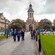 Tourists walking along a cobblestone path on the campus of Trinity College